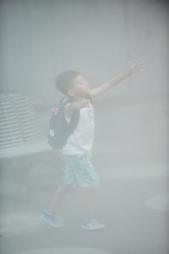 Water mists help visitors stay cool at Expo Park