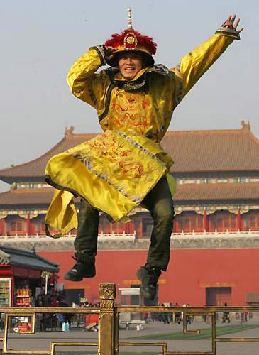 Du Yize, a young Chinese parkour fan, practices at a plaza in front of the Forbidden City in Beijing. [Photo: China Photo Press]