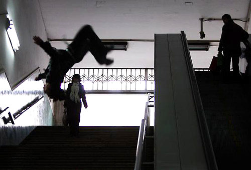 Du Yize, a young Chinese parkour fan, practices in a subway station in Beijing. [Photo: China Photo Press]