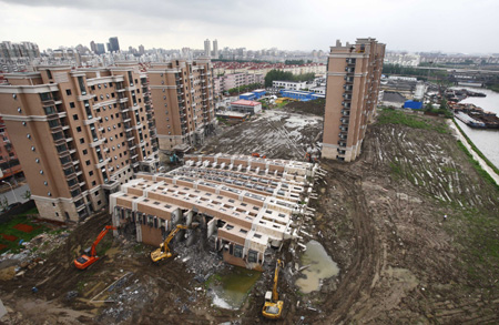 Demolition of collapsed building in Shanghai underway