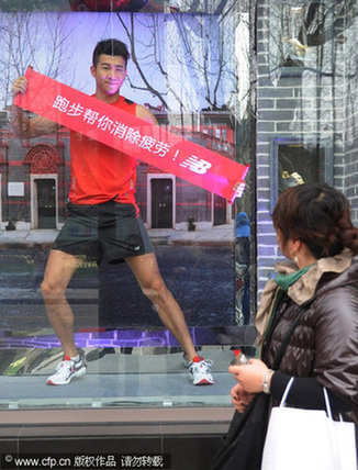 Model jogs in window to promte a healthy workout