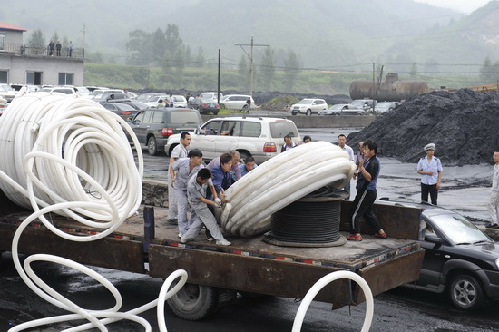 18 trapped in NE China flooded coal mine