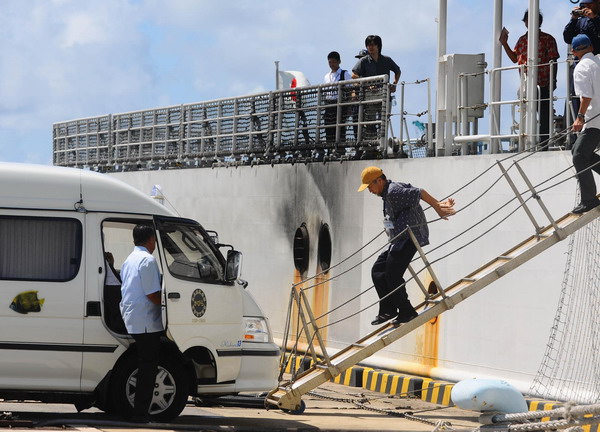 Chinese boat crew flying home