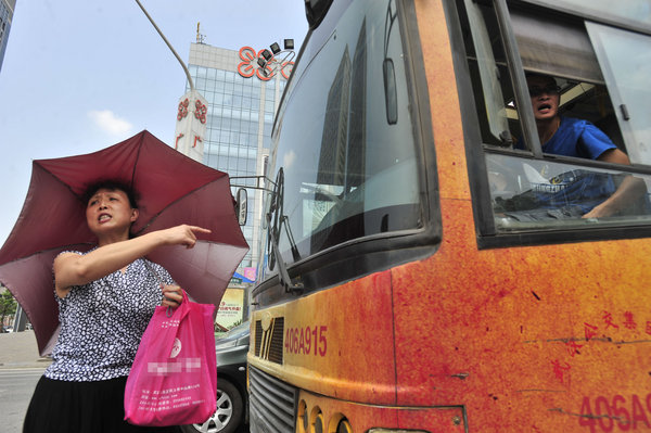 Frustrated commuters block bus in protest