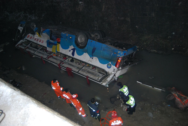 At least 18 killed after tourist bus falls off highway bridge in SW China