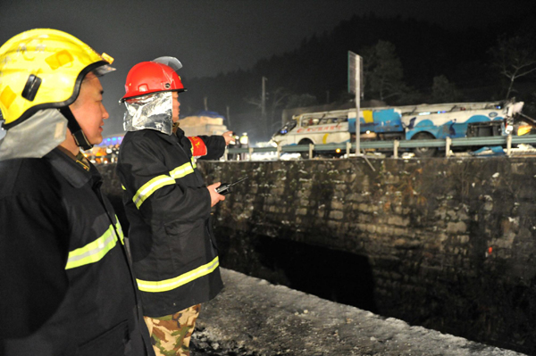 At least 18 killed after tourist bus falls off highway bridge in SW China