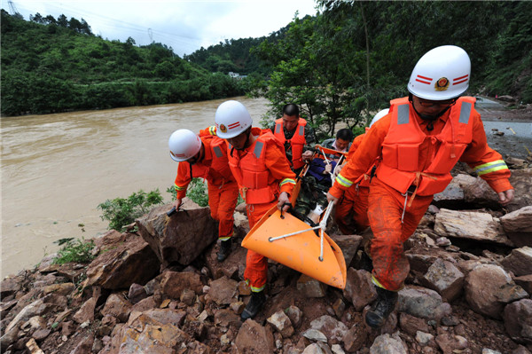 33 dead, 12 missing in S China storms