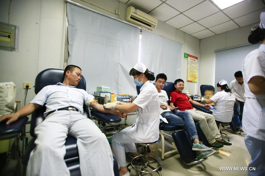 People donate blood for injured workers in factory blast