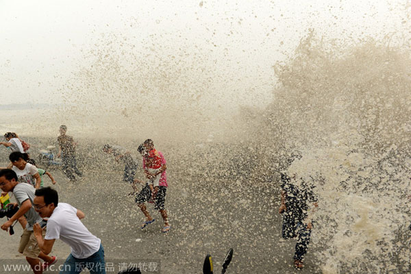 Qiantang river tide drenches spectators