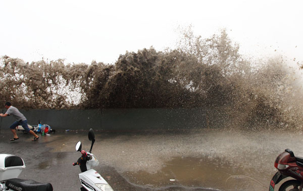 Qiantang river tide drenches spectators