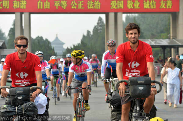 Duo ends pedal-powered journey from Paris to Beijing