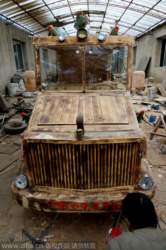 Carpenter carves armored vehicle from wood