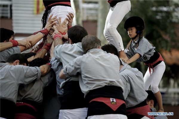 Chinese girl in local Spanish human tower team