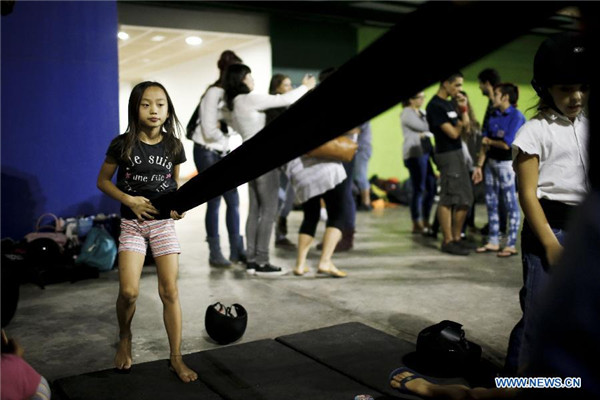 Chinese girl in local Spanish human tower team