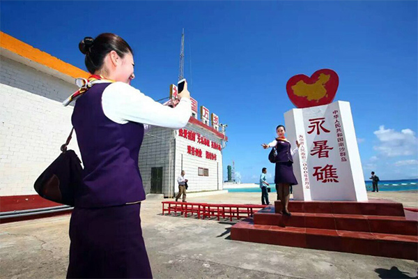 Chinese stewardess celebrate test flight at Nansha Islands airfield