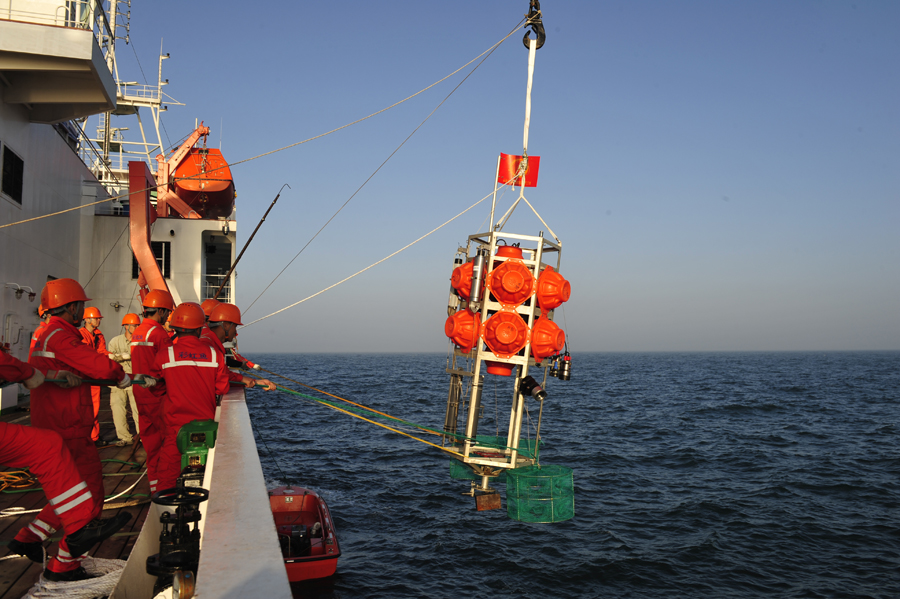 Staff practice submersible Rainbow Fish on research vessel in S. China Sea