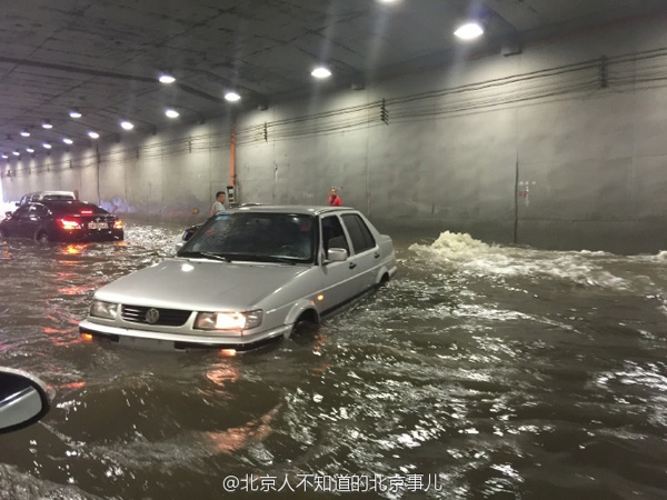 Beijing issues orange alert for heavy rain, train, flights delayed