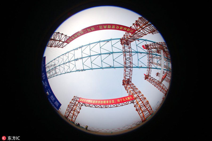 Arch of world's longest cable-stayed bridge joined