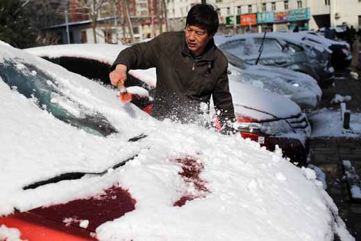 组图：三月降春雪 素裹银装扮靓京城