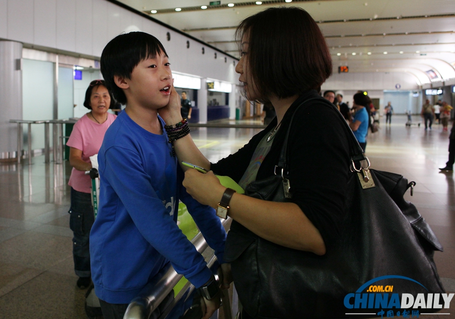 “海娜号”邮轮滞留韩国游客陆续抵达北京