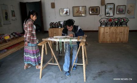 Disabled man opens embroidery workshop in C. China's Hunan