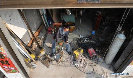 Farmer dreams of making his own helicopeter in Ganzhou Village in Miluo City