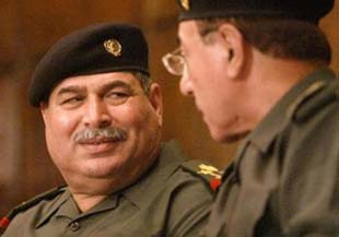 Former Iraqi Defense Minister surrenders-mediator
