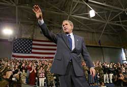 Bush, in campaign mode, challenges critics on Iraq
