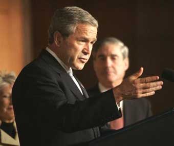 US President Bush makes remarks before signing into law the The Intelligence Reform and Terrorism Prevention Act of 2004, Friday, Dec. 17, 2004, in Washington. The new law is the largest overhaul of U.S. intelligence gathering in 50 years, hoping to improve the spy network that failed to prevent the Sept. 11 attacks. [AP]