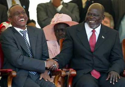 Sudan's First Vice President Ali Osman Mohamed Taha (L) and Sudan People's Liberation Movement leader John Garang(R) share a laugh before the signing of the Comprehensive Peace Agreement in Nairobi, January 9, 2005. Bare-chested warriors danced and turbaned heads bowed in prayer while Sudan's Islamist government and southern rebels forged a comprehensive peace Sunday ending Africa's longest-running civil war. [Reuters] 