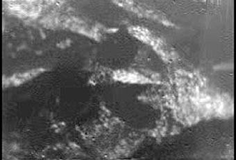 This is one of the first raw, or unprocessed, images from the European Space Agency's Huygens probe as it descended to Saturn's moon Titan January 14, 2005 and released, January 14, 2005. It was taken with the Descent Imager/Spectral Radiometer, one of two NASA instruments on the probe. The Cassini-Huygens mission is a cooperative project of NASA, the European Space Agency and the Italian Space Agency. [Reuters]