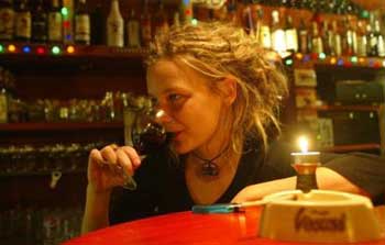 A young girl drinks a glass of wine in a bar in downtown Prague, Czech Republic, in this photo taken Friday, Dec. 10, 2004. Drinking is a national pastime in this beer-loving country, but authorities and health experts concede they've got trouble on their hands: a growing number of underaged youths, some as young as 10, who are hitting the bottle regularly. (AP 
