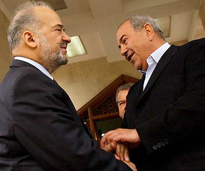 Iraq's interim Prime Minister Iyad Allawi (R) greets Dawa party leader Ibrahim Jaafari (L) at the end of their meeting inside Baghdad's heavily protected "Green zone", February 21, 2005. The battle to become Iraq's prime minister heated up on Monday when interim leader Iyad Allawi's coalition formally put him forward as a candidate after last month's historic elections won by a Shi'ite alliance. If the main Shi'ite alliance and the Kurds were to ally, they could grasp a two-thirds majority and decide the top government posts between them. Until Allawi joined the running on Monday, that had appeared the most likely scenario. Adding intrigue to the horse-trading, Allawi met Jaafari for more than an hour of talks on Monday. "We evaluated the election process," Jaafari said afterwards, giving no details. He expected it to be a couple more days before the main Shi'ite alliance names a candidate. [Reuters]