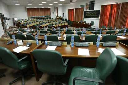 A general view of empty Palestinian Legislative Council in the West Bank town of Ramallah, February 23, 2005. Palestinian Prime Minister Ahmed Qurie won the agreement of lawmakers for a new cabinet on Wednesday after a third successive day of crisis over demands for more reformers and fewer Yasser Arafat loyalists. [Reuters]
