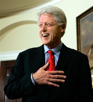 After answering questions on his surgery scheduled later this week, former President Clinton (news - web sites) laughs as he finishes up a session with reporters in the Roosevelt Room of the White House, in Washington, Tuesday, March 8, 2005. Clinton, who underwent quadruple bypass surgery in September, will undergo a medical procedure this week to remove fluid and scar tissue from his left chest, his office announced Tuesday. He was at the White House with former President George H. W. Bush to report on their tour of the Asian tsunami region. (AP Photo/J. Scott Applewhite) 