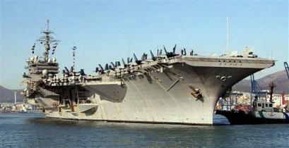 The U.S. aircraft carrier USS Kitty Hawk arrives for scheduled joint U.S.-South Korean military exercises, in South Korea's port city of Busan, south of Seoul, Monday, March 14, 2005. The United States and South Korea will conduct joint military exercises this week amid a standoff over North Korea's nuclear weapons program. [AP]