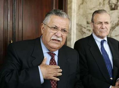 Iraqi President Jalal Talibani (L) and U.S. Secretary of Defense Donald Rumsfeld talk at a press availability in Baghdad, Iraq, April 12, 2005. REUTERS/Gerald Herbert/Pool