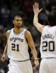 San Antonio Spurs forward Tim Duncan (21) celebrates with teammate Manu Ginobili (20), of Argentina, against the Denver Nuggets during the fourth quarter of Game 5 of their first-round playoff series in San Antonio, Wednesday, May 4, 2005. San Antonio won 99-89, winning the series 4-1. (AP
