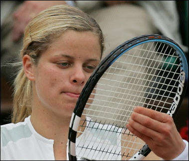 Belgium Kim Clijsters reacts after loosing against US Lindsay Davenport after their fourth round match of the tennis French Open at Roland Garros, in Paris. Veteran Grand Slam queens Davenport and Mary Pierce battled through to a French Open quarter-final showdown but Bulgarian 15-year-old Sesil Karatantcheva gave notice that the clock is ticking on the old-timers.(AFP