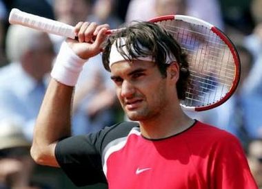 Switzerland's Roger Federer reacts after winning his quarter-final match against Romania's Victor Hanescu in the French Open tennis tournament at the Roland Garros stadium, May 31, 2005. Federer won 6-2 7-6 6-3. REUTERS