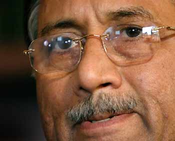 Pakistan's President Pervez Musharraf listens to a question during an interview in Canberra June 14, 2005. Australia and Pakistan are to sign a new counter-terrorism pact during a visit by Musharraf which began on Monday, officials said. REUTERS