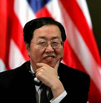 China's central bank chief Zhou Xiaochuan listens during a discussion at the International Monetary Conference in Beijing June 7, 2005.