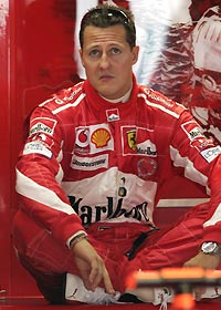 Ferrari's World Champion Michael Schumacher of Germany sits in his pit during a practice session at the Hockenheim race track, July 23, 2005. 