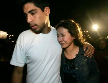 Unidentified relatives of victims of a downed Peruvian airliner arrive at Jorge Chavez airport in Lima, Peru on Tuesday, Aug. 23, 2005.