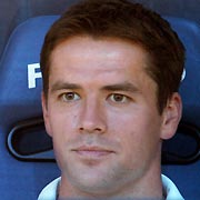 Real Madrid's Michael Owen sits on the bench before the start of their Santiago Bernabeu Trophy exhibition match against U.S. MLS All-Stars in Madrid August 23, 2005. 