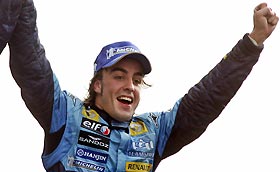 Renault's Formula One driver Fernando Alonso of Spain celebrates his second place in the Italian Grand Prix, at the Monza race track in northern Italy, September 4, 2005. 
