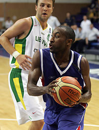 Russia's Jon Holden (R), who is a native American, plays against Vidas Ginevicius of Lithuania in a friendly before the European championship in Moscow September 8, 2005. Jon Holden is about to make history becoming the first American athlete in any sport to represent Russia in international competition.