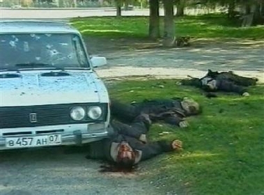 Bodies of apparent militants lie in a street in Nalchik, Thursday, Oct. 13, 2005 in this image taken from television.