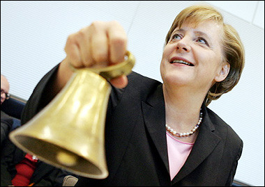 German Chancellor-designate Angela Merkel calls the room to order with a bell prior a meeting of the Christian Democratic Union (CDU) parliamentary group at the parliament in Berlin.