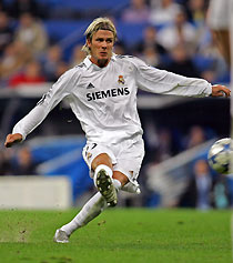 vReal Madrid's Beckham shoots to score against Rosenborg Trondheim during their Champions League soccer match in Madrid 